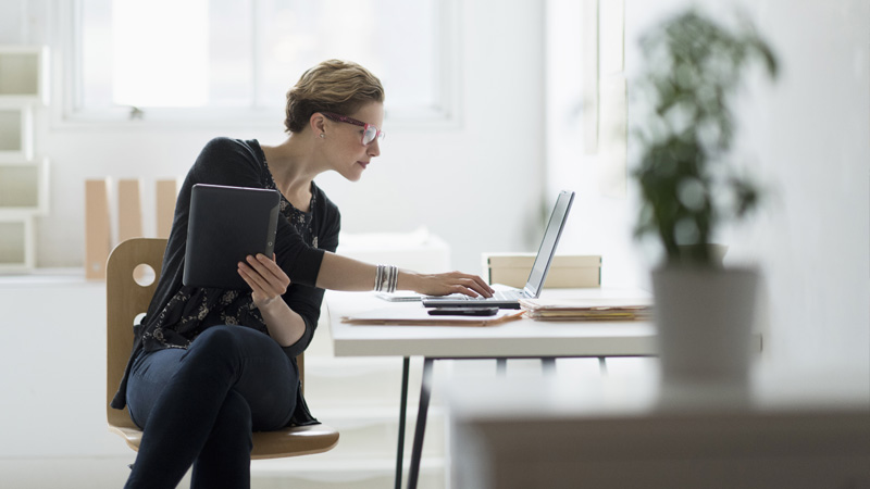 A woman using a laptop to shop online