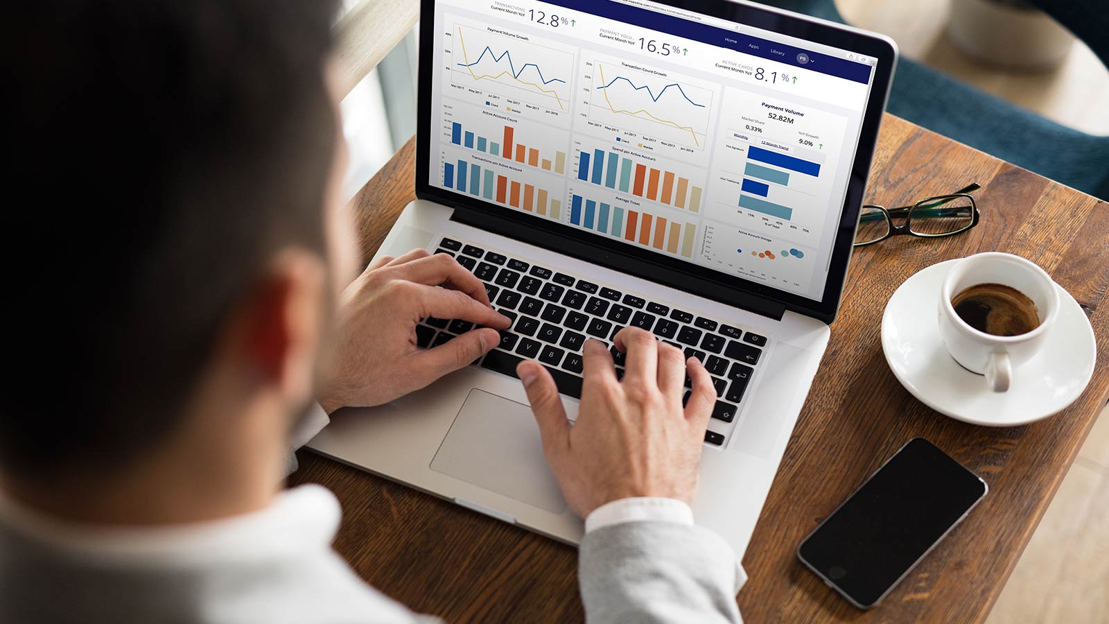 Businessman looking at analytics on laptop screen