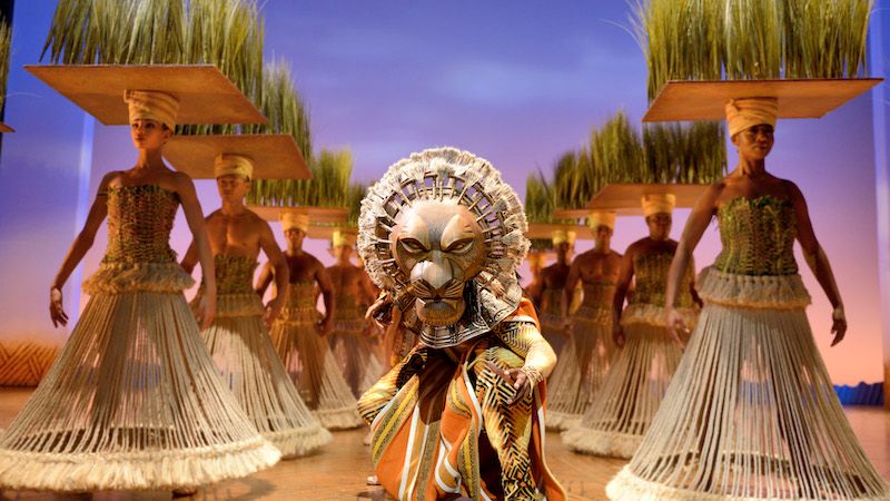 Dinseys The Lion King actor on stage in lion costume